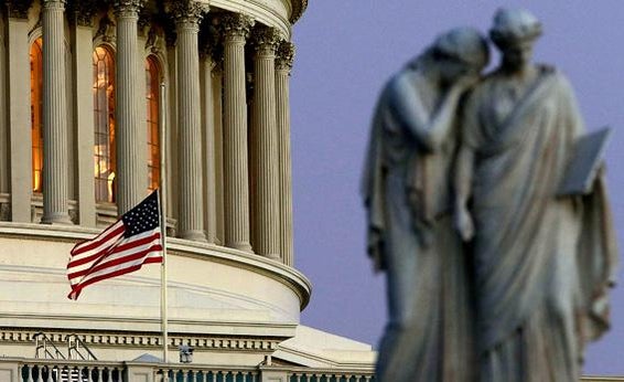 A flag at the U.S. Capitol flies at half-staff after President Barack Obama ordered the action while speaking on the shootings at the Sandy Hook Elementary School.